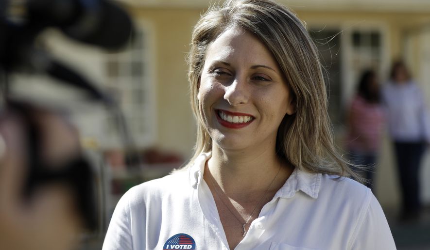In this Nov. 6, 2018, photo, Katie Hill speaks during an interview after voting in Agua Dulce, Calif.  Hill announced her resignation over the weekend following the publication of explicit photos that outed the relationship. She describes the photos as “revenge porn” and is vowing to fight the problem so that women and girls don’t shy away from politics in the future. Hill&#39;s resignation in a sex scandal she blamed on an abusive husband has observers wondering if women are held to higher standards in public life and what the future holds for politicians coming of age in the iPhone era. (AP Photo/Marcio Jose Sanchez) **FILE**