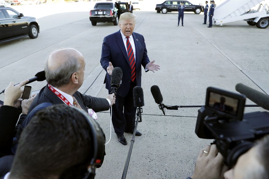 President Donald Trump talks to reporters before boarding Air Force One for a trip to Chicago to attend the International Association of Chiefs of Police Annual Conference and Exposition, Monday, Oct. 28, 2019, in Andrews Air Force Base, Md. (AP Photo/Evan Vucci)