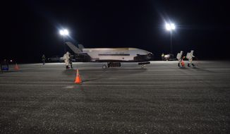 In this Oct. 27, 2019 photo released by the U.S. Air Force, the Air Force’s X-37B successfully lands at NASA’s Kennedy Space Center Shuttle Landing Facility on Merritt Island in Brevard County, Fla., following a record-breaking two-year mission.  (U.S. Air Force via AP)