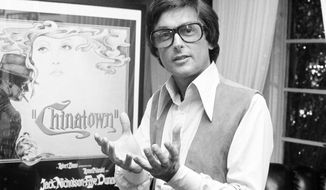 FILE - This 1974 file photo shows Paramount Pictures production chief Robert Evans talking about his film &amp;quot;Chinatown&amp;quot; in his office in Beverly Hills, Calif. A representative for Evans, the producer of “The Godfather” and “Chinatown,”  confirmed that Evans passed away Saturday, Oct. 26, 2019. He was 89. No other details were immediately available. (AP Photo/Jeff Robbins)