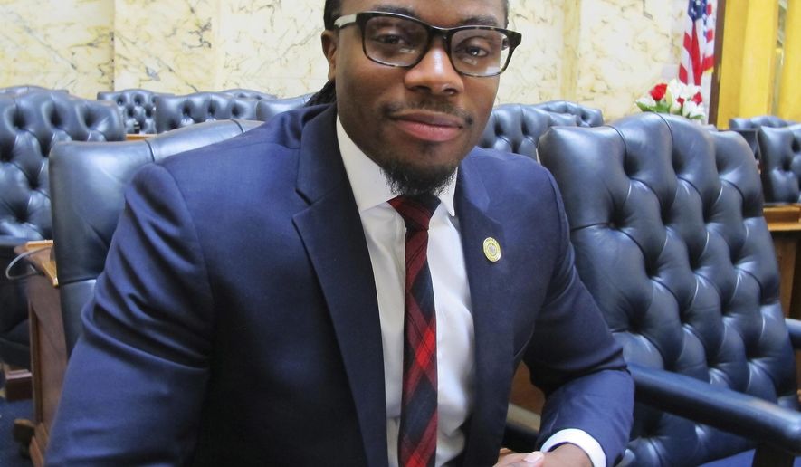 In this Saturday, April 7, 2018 photo, Maryland Del. Alonzo Washington, D-Prince George County, who sponsored legislation in Maryland to increase transparency in online political ads, sits in his seat in the Maryland House of Delegates, in Annapolis, Md. The bill, which was passed and sent to Gov. Larry Hogan on April 5, aims to help stop foreign influence in the state's elections. (AP Photo/Brian Witte)