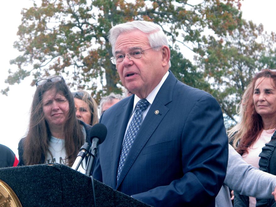 U.S. Sen Robert Menendez of New Jersey speaks at a news conference in front of the newly rebuilt home of a couple who were displaced by Superstorm Sandy in Toms River, N.J. a day before the seventh anniversary of the storm. New Jersey officials say about 700 people enrolled in its main post-Sandy rebuilding program still have not finished their homes. (AP Photo/Wayne Parry)