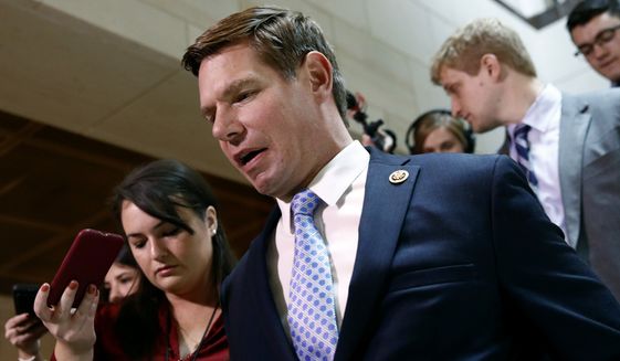 Rep. Eric Swalwell, D-Calif., walks to a secure area of the Capitol where Army Lt. Col. Alexander Vindman, a military officer at the National Security Council, arrived for a closed-door meeting to testify as part of the House impeachment inquiry into President Donald Trump, Tuesday, Oct. 29, 2019, in Washington. (AP Photo/Patrick Semansky) **FILE**