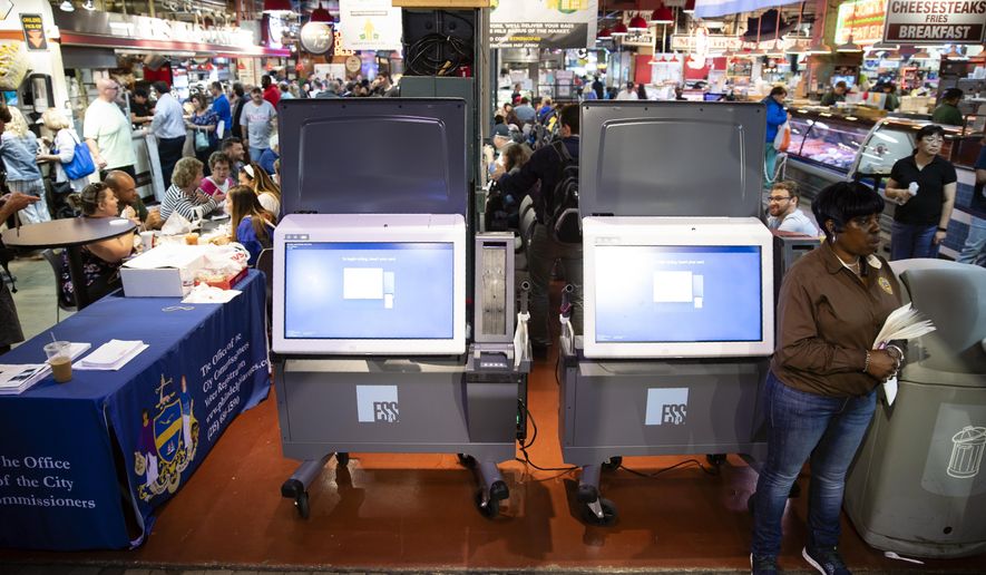FILE - In this June 13, 2019, file photo, ExpressVote XL voting machines are displayed during a demonstration at the Reading Terminal Market in Philadelphia. Legislation speeding toward approval in Pennsylvania would deliver the biggest changes to state election laws in decades while approving much of the money it'll cost counties to buy new voting machines ahead of next year's presidential election. (AP Photo/Matt Rourke, File)