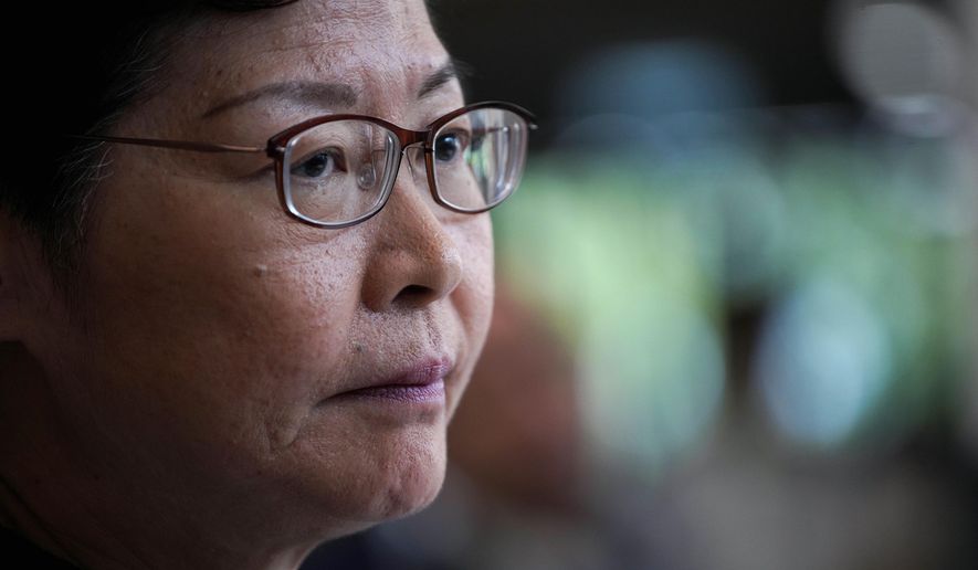 Hong Kong Chief Executive Carrie Lam attends a press conference in Hong Kong, Tuesday, Oct. 29, 2019. Hong Kong's leader says the city is at risk of falling into a recession as it enters its fifth month of pro-democracy protests, and she says her priority was ending violence first before a political resolution. (AP Photo/Vincent Yu)