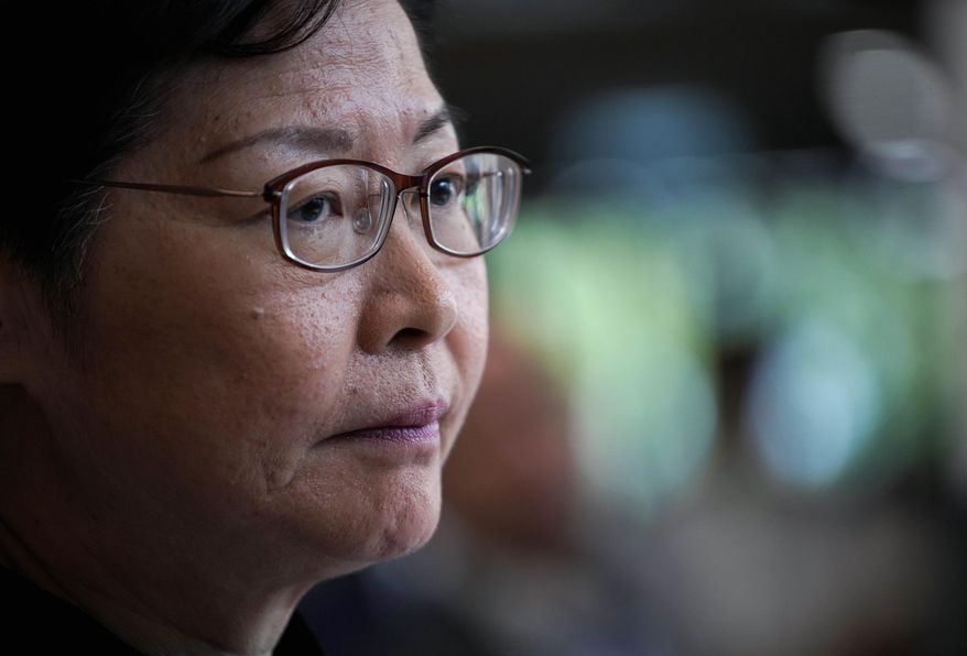Hong Kong Chief Executive Carrie Lam attends a press conference in Hong Kong, Tuesday, Oct. 29, 2019. Hong Kong's leader says the city is at risk of falling into a recession as it enters its fifth month of pro-democracy protests, and she says her priority was ending violence first before a political resolution. (AP Photo/Vincent Yu)