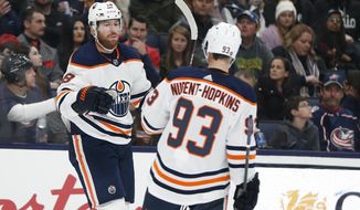 Edmonton Oilers&#39; James Neal, left, celebrates his goal against the Columbus Blue Jackets with teammate Ryan Nugent-Hopkins during the first period of an NHL hockey game Wednesday, Oct. 30, 2019, in Columbus, Ohio. (AP Photo/Jay LaPrete)