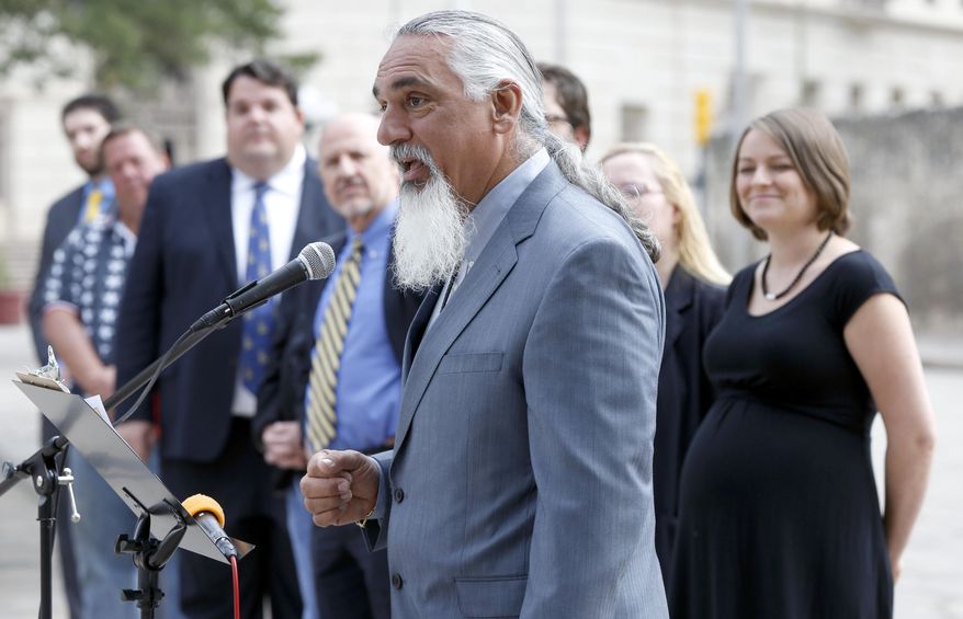 In this May 1, 2014 photo, Libertarian party candidate for Texas attorney general Jamie Balagia speaks in front of the Alamo in San Antonio, Texas, about his election platform. Balagia, who made a name for himself defending people charged with drunken driving, was convicted Tuesday, Oct. 29, 2019, of federal corruption charges in connection with his scheme to shake down international drug traffickers. (William Luther/The San Antonio Express-News via AP)