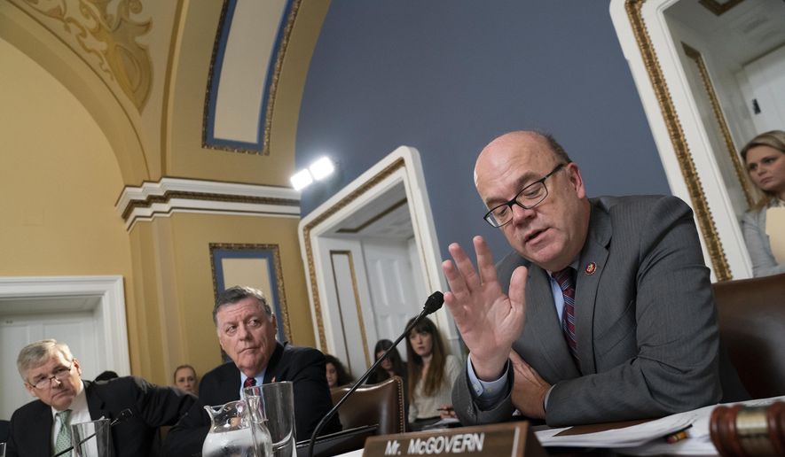 House Rules Committee Chairman Jim McGovern, D-Mass., joined from left by Rep. Rob Woodall, R-Ga., and Rep. Tom Cole, R-Okla., presides over a markup of the resolution that will formalize the next steps in the impeachment inquiry of President Donald Trump, at the Capitol in Washington, Wednesday, Oct. 30, 2019. (AP Photo/J. Scott Applewhite) ** FILE **