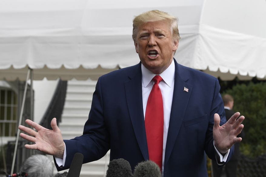 In this Oct. 25, 2019, photo, President Donald Trump talks to reporters on the South Lawn of the White House in Washington. Trumps approval rating is holding steady as the House presses forward with an impeachment probe that could imperil his presidency, according to a new poll from The Associated Press-NORC Center for Public Affairs Research. (AP Photo/Susan Walsh)