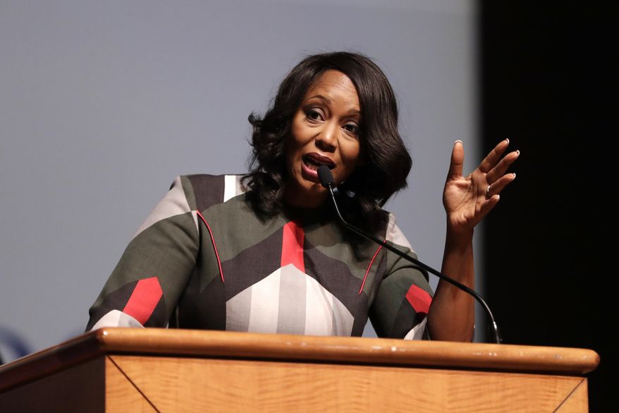 Maya Rockeymoore Cummings, widow of U.S. Rep. Elijah Cummings, speaks during a viewing service at Morgan State University, Wednesday, Oct. 23, 2019, in Baltimore. The Maryland congressman and civil rights champion died Thursday, Oct. 17, at age 68 of complications from long-standing health issues. (AP Photo/Julio Cortez)