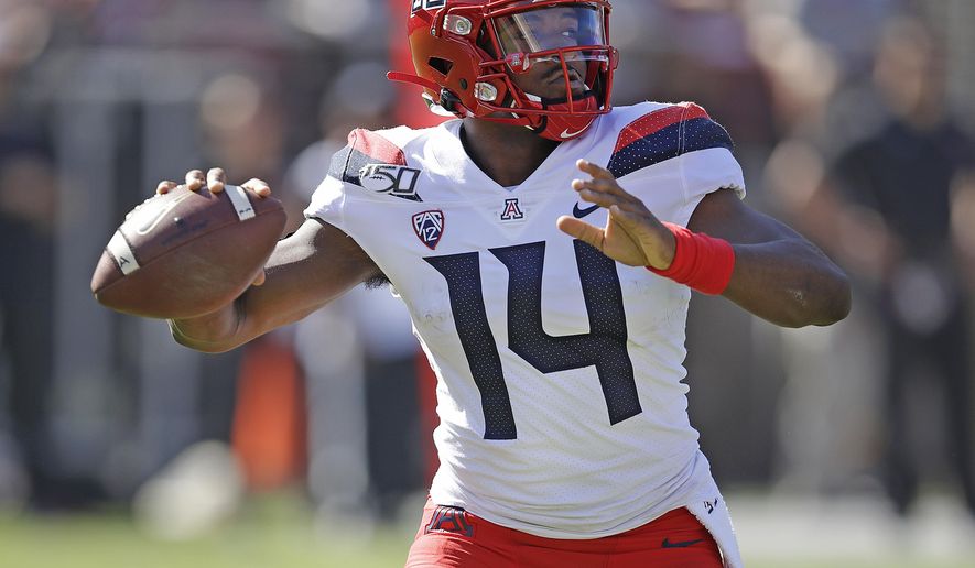 Arizona quarterback Khalil Tate passes against Stanford in the first half of an NCAA college football game Saturday, Oct. 26, 2019, in Stanford, Calif. (AP Photo/Ben Margot)
