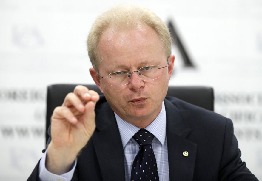 Mark Schipp, the President of World Organization for Animal Health briefs media in Sydney, Thursday, Oct. 31, 2019, on the threat of African swine fever. Schipp says that the spread of the disease in the past year to countries including China, which has half the world's pig population, had inflamed a worldwide crisis. (AP Photo/Rick Rycroft)