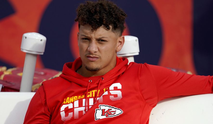 FILE - In this Thursday, Oct. 17, 2019, file photo, Kansas City Chiefs quarterback Patrick Mahomes sits on the bench prior to an NFL football game against the Denver Broncos in Denver. The Chiefs have ruled Mahomes out for Sunday night&#39;s showdown against the Green Bay Packers because of his dislocated right kneecap. Mahomes, who hurt his knee last Thursday night in Denver, was a limited participant in practice all week. (AP Photo/Jack Dempsey, File)