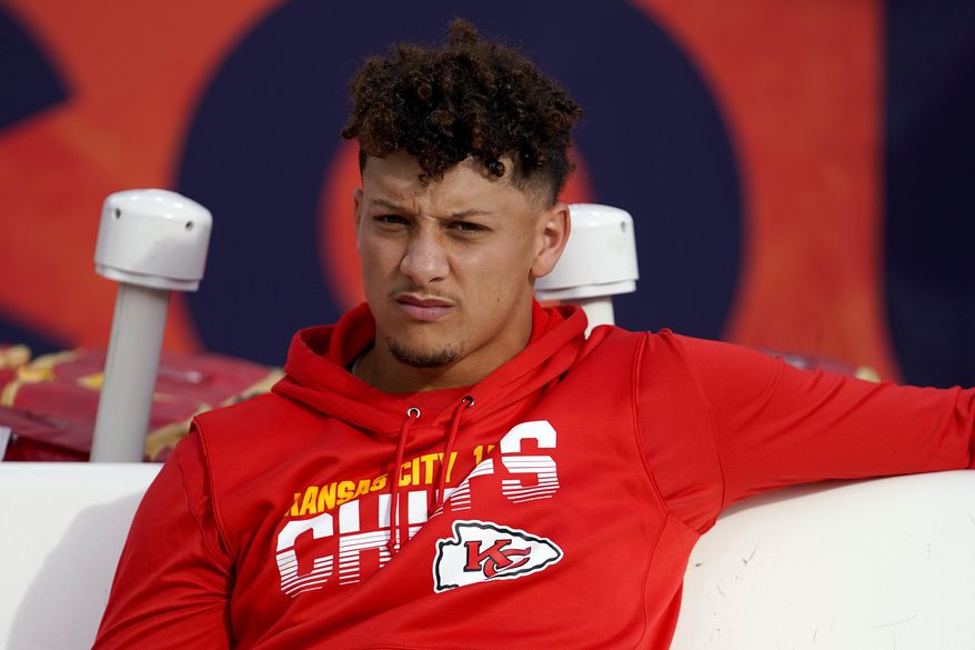 FILE - In this Thursday, Oct. 17, 2019, file photo, Kansas City Chiefs quarterback Patrick Mahomes sits on the bench prior to an NFL football game against the Denver Broncos in Denver. The Chiefs have ruled Mahomes out for Sunday night&#39;s showdown against the Green Bay Packers because of his dislocated right kneecap. Mahomes, who hurt his knee last Thursday night in Denver, was a limited participant in practice all week. (AP Photo/Jack Dempsey, File)