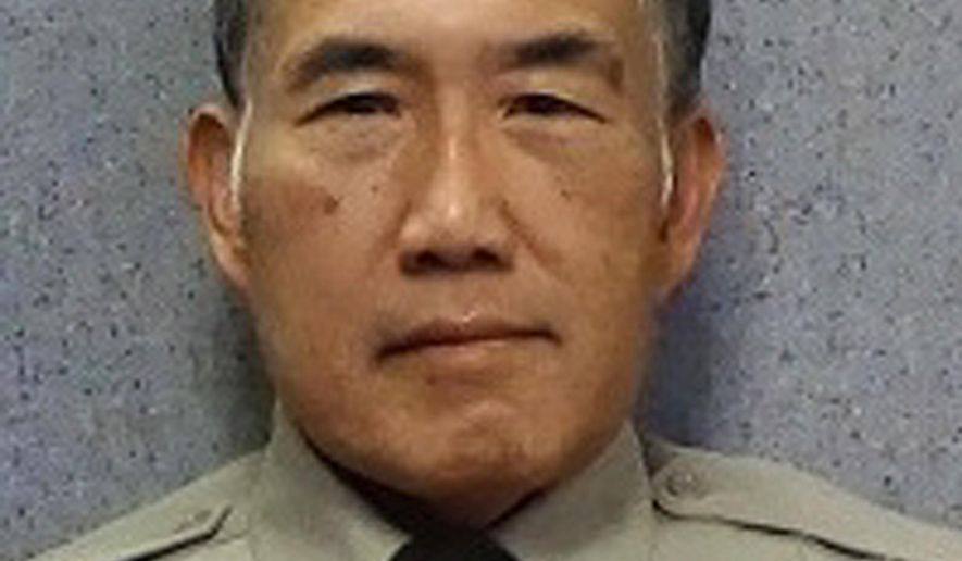 In this undated photo released by the Maricopa County Sheriff's Office is Officer Gene Lee. Authorities say Lee, a Phoenix area jail officer who was comatose after being attacked by an inmate has died. Maricopa County Sheriff Paul Penzone said 59-year-old Daniel Davitt attacked Officer Gene Lee without provocation Tuesday, Oct. 29, 2019. He said Lee was grabbed by the throat from behind and knocked to the ground. Penzone said Lee's head hit the cement floor and he never regained consciousness. Davitt faces sex crime charges involving children and is representing himself. (Maricopa County Sheriff's Office via AP)