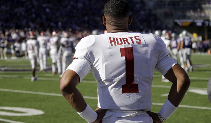 Oklahoma quarterback Jalen Hurts watches from the sideline during the final moments of an NCAA college football game against Kansas State, Saturday, Oct. 26, 2019, in Manhattan, Kan. Kansas State won 48-41. (AP Photo/Charlie Riedel)