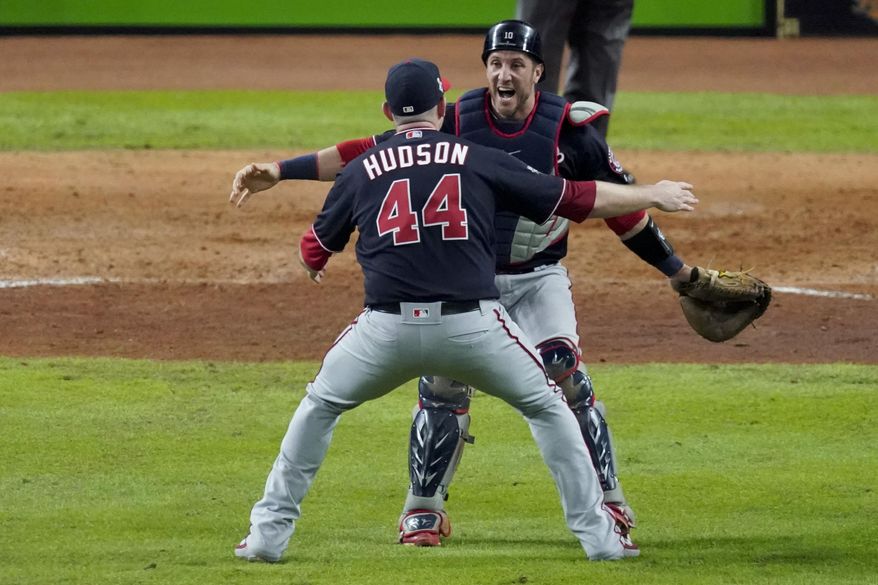 Washington Nationals relief pitcher Daniel Hudson and catcher Yan Gomes celebrate after Game 7 of the baseball World Series against the Houston Astros Wednesday, Oct. 30, 2019, in Houston. The Nationals won 6-2 to win the series. (AP Photo/Eric Gay)