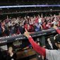 Washington Nationals manager Dave Martinez waves to the fans after Game 7 of the baseball World Series against the Houston Astros Wednesday, Oct. 30, 2019, in Houston. The Nationals won 6-2 to win the series. (AP Photo/David J. Phillip)