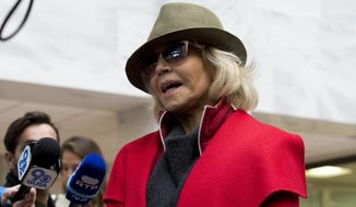 Actress and activist Jane Fonda talk to reporters at Hart Senate Office Building as she and other demonstrators called on Congress for action to address climate change, on Capitol Hill in Washington, Friday, Nov. 1, 2019. A half-century after throwing her attention-getting celebrity status into Vietnam War protests, Fonda is now doing the same in a U.S. climate movement where the average age is 18. (AP Photo/Jose Luis Magana)