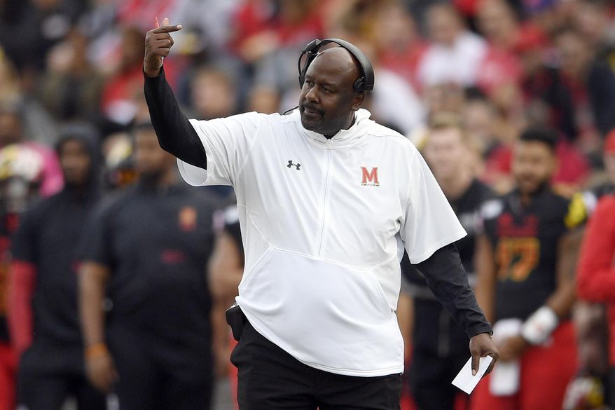 FILE - In this Saturday, Oct. 19, 2019, file photo, Maryland head coach Mike Locksley gestures during the first half of an NCAA football game against Indiana in College Park, Md. In his first year at Maryland, Locksley has formed a close rapport with his players. Although the Terrapins (3-4, 1-3) have dropped four of five and appeared destined for a fourth consecutive losing season, no one has asked for a redshirt. (AP Photo/Nick Wass, File)