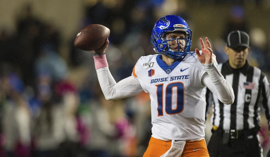 Boise State quarterback Chase Cord (10) throws a pass during the first half of the team's NCAA college football game against BYU on Saturday, Oct. 19, 2019, in Provo, Utah. (AP Photo/Tyler Tate)
