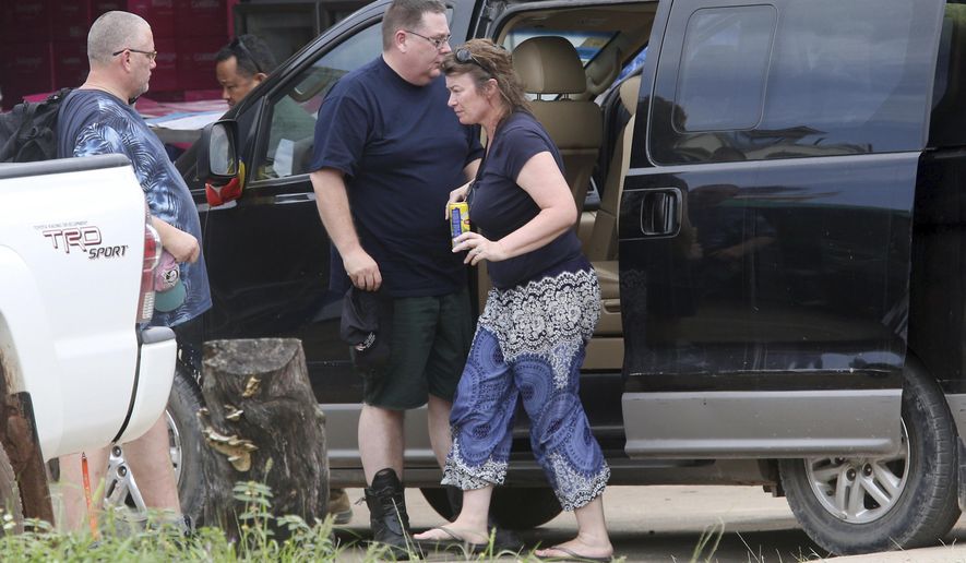 Linda Schultes, right, mother of British backpacker Amelia Bambridge, arrives in a van together with her family members at the Sihanoukville Referral Hospital in Sihanoukville province, Cambodia, Friday, Nov. 1, 2019. The body of the British backpacker missing for more than a week in Cambodia was found at sea Thursday about 60 miles (100 kilometers) from the island where she disappeared, officials said. (AP Photo/Heng Sinith)
