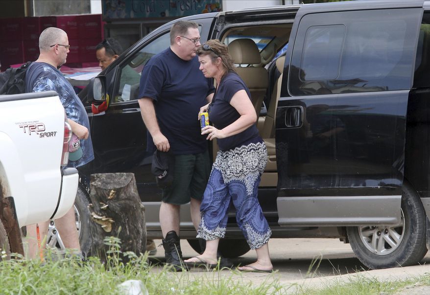 Linda Schultes, right, mother of British backpacker Amelia Bambridge, arrives in a van together with her family members at the Sihanoukville Referral Hospital in Sihanoukville province, Cambodia, Friday, Nov. 1, 2019. The body of the British backpacker missing for more than a week in Cambodia was found at sea Thursday about 60 miles (100 kilometers) from the island where she disappeared, officials said. (AP Photo/Heng Sinith)