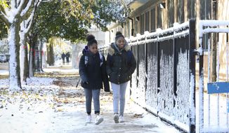 Students return to school at Yates Elementary Friday, Nov. 1, 2019, in Chicago after a Chicago Teachers Union strike closed schools for 11 days. (AP Photo/Teresa Crawford)