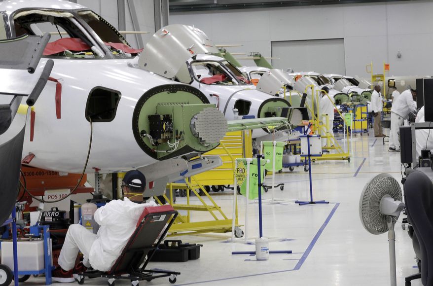 FILE - In this July 30, 2019, file photo people work in the production area at the Honda Aircraft Co. headquarters in Greensboro, N.C. where the HondaJet Elite aircraft is manufactured. On Friday, Nov. 1, the Institute for Supply Management, an association of purchasing managers, reports on activity by U.S. manufacturers in October. (AP Photo/Gerry Broome, File)