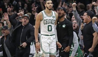Fans cheer after Boston Celtics forward Jayson Tatum (0) hit a jump shot in the finals seconds in the team&#39;s NBA basketball game against the New York Knicks, Friday, Nov. 1, 2019, in Boston. The Celtics won 104-102. (AP Photo/Elise Amendola)