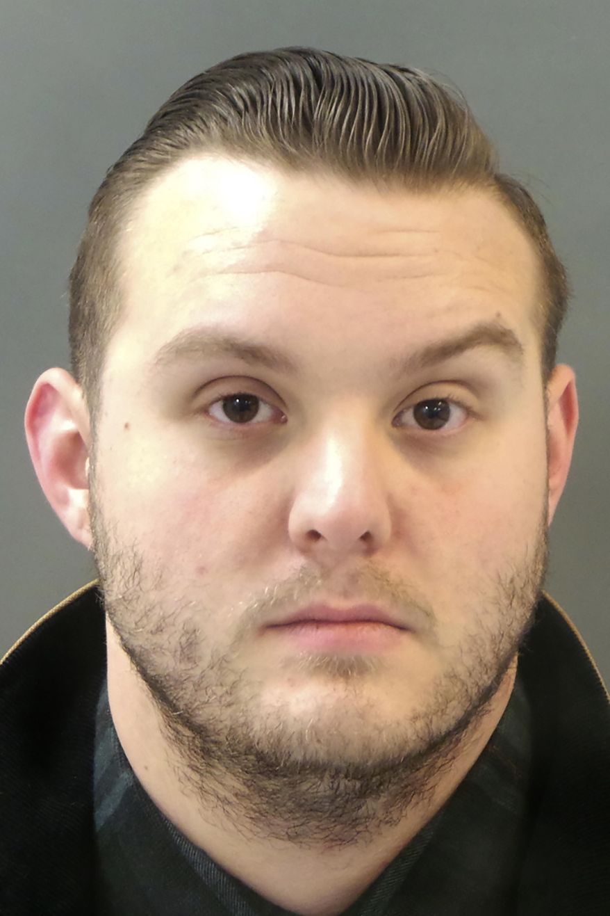 This undated photo provided by the St. Louis Police Department shows St. Louis police officer Matthew EerNisse, who has been charged with first-degree assault for allegedly shooting a car thief suspect in the back. The shooting happened in 2018. The suspect survived. Charges follow an internal police investigation. (St. Louis Police Department via AP)