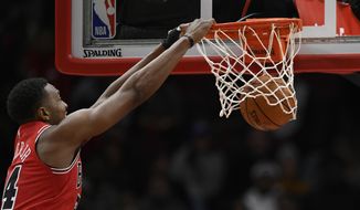 Chicago Bulls&#39; Wendell Carter Jr. dunks during the first half of the team&#39;s NBA basketball game against the Detroit Pistons on Friday, Nov. 1, 2019, in Chicago. (AP Photo/Paul Beaty)