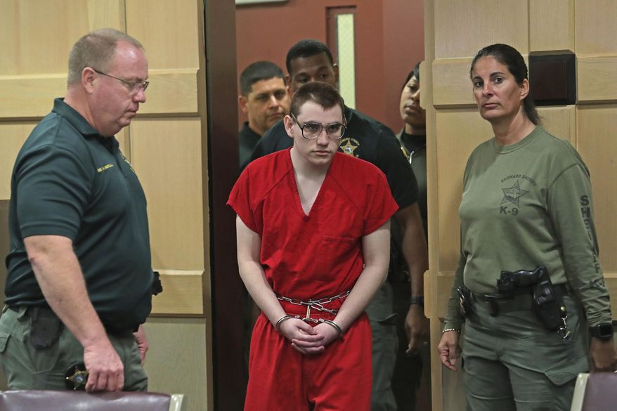 FILE - In this Wednesday, Jan. 16, 2019, file photo, Parkland school shooting suspect Nikolas Cruz is escorted into the courtroom for a status hearing at the Broward Courthouse in Fort Lauderdale, Fla. A series of defense motions are set to be heard in the case of Nikolas Cruz, accused in the killing of 17 people at a Florida high school last year. Two court hearings are scheduled Friday, Nov. 1, 2019 for the 21-year-old Cruz, who faces the death penalty if convicted in the February 2018 massacre at Marjory Stoneman Douglas High School. (John McCall/South Florida Sun-Sentinel via AP, Pool, File)