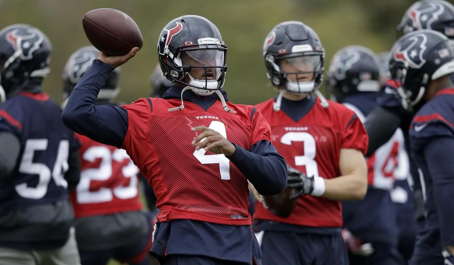 Houston Texans' quarterback Deshaun, 4, takes part in an NFL practice session at the London Irish rugby team training ground in the Sunbury-on-Thames suburb of south west London, Friday, Nov. 1, 2019. The Houston Texans are preparing for an NFL regular season game against the Jacksonville Jaguars in London on Sunday. (AP Photo/Matt Dunham)