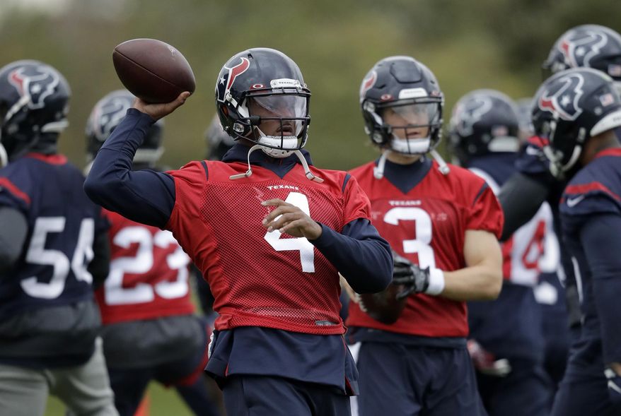 Houston Texans' quarterback Deshaun, 4, takes part in an NFL practice session at the London Irish rugby team training ground in the Sunbury-on-Thames suburb of south west London, Friday, Nov. 1, 2019. The Houston Texans are preparing for an NFL regular season game against the Jacksonville Jaguars in London on Sunday. (AP Photo/Matt Dunham)