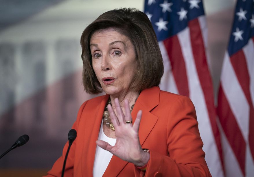 Speaker of the House Nancy Pelosi, D-Calif., talks to reporters just before the House vote on a resolution to formalize the impeachment investigation of President Donald Trump, in Washington, Thursday, Oct. 31, 2019. (AP Photo/J. Scott Applewhite)