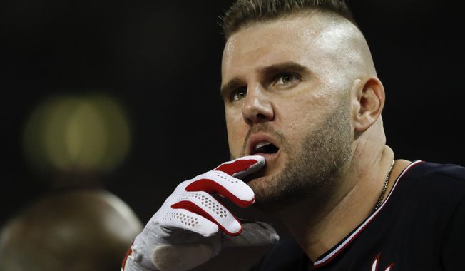 Washington Nationals first baseman Matt Adams watches during the sixth inning of Game 5 of the baseball World Series against the Houston Astros Sunday, Oct. 27, 2019, in Washington. (AP Photo/Jeff Roberson)