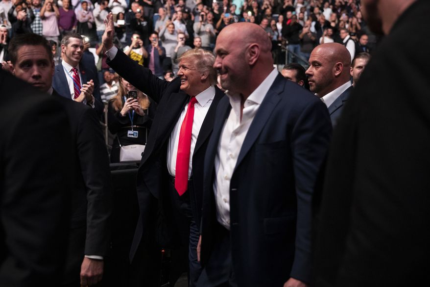 President Donald Trump and UFC president Dana White arrive at Madison Square Garden to attend the UFC 244 mixed martial arts fights, Saturday, Nov. 2, 2019, in New York. (AP Photo/ Evan Vucci)