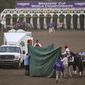 Track workers treat Mongolian Groom after the Breeders&#x27; Cup Classic horse race at Santa Anita Park, Saturday, Nov. 2, 2019, in Arcadia, Calif. The jockey eased him up near the eighth pole in the stretch. The on-call vet says he has &amp;quot;serious&amp;quot; injury to leg. Was taken to equine hospital on the grounds. (AP Photo/Mark J. Terrill)
