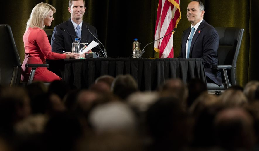FILE - In this Tuesday, Oct. 29, 2019 file photo, Sheree Paolello of WLWT moderates the final gubernatorial debate between Democratic candidate Andy Beshear, center, and Gov. Matt Bevin in Highland Heights, Ky. (Albert Cesare/The Cincinnati Enquirer via AP, Pool)