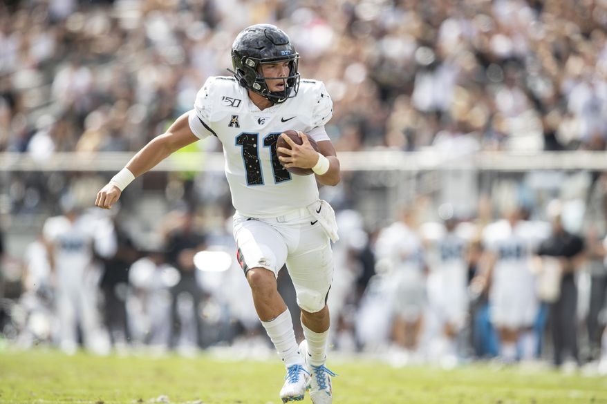 Central Florida quarterback Dillon Gabriel (11) runs the ball into the end zone for a touchdown during the first half of an NCAA college football game against Houston in Orlando, Fla., Saturday, Nov. 2, 2019. (Photo/Willie J. Allen Jr.)