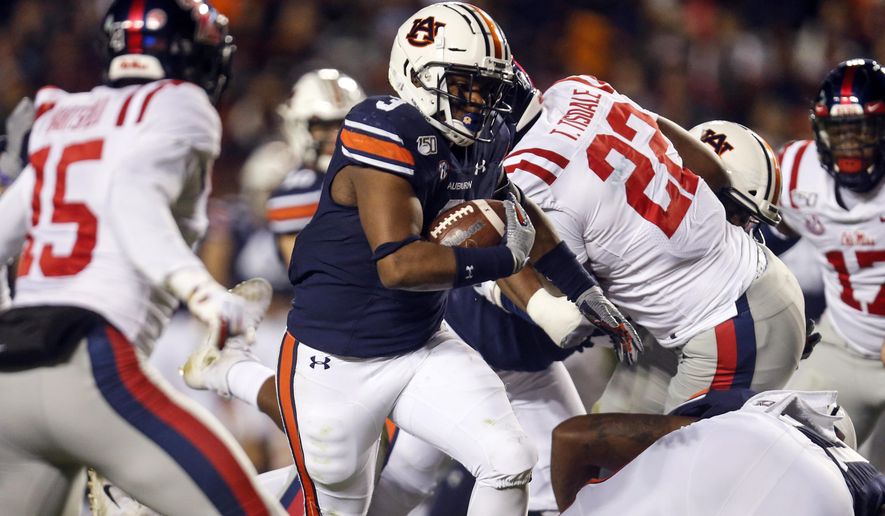 Auburn running back D.J. Williams (3) carries the ball during the first half of the team's NCAA college football game against Mississippi, Saturday, Nov. 2, 2019, in Auburn, Ala. (AP Photo/Butch Dill)