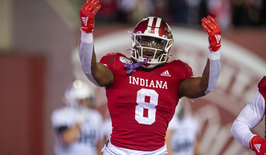 Indiana running back Stevie Scott III (8) reacts in the end zone after scoring a touchdown during the first half of an NCAA college football game against Northwestern, Saturday, Nov. 2, 2019, in Bloomington, Ind. (AP Photo/Doug McSchooler)