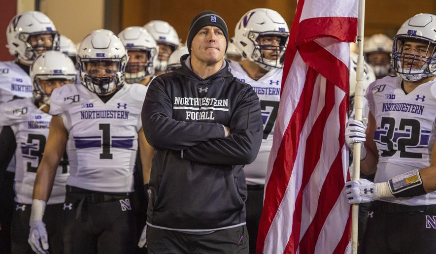 Northwestern head coach Pat Fitzgerald waits with the team to take the field before an NCAA college football game against Indiana, Saturday, Nov. 2, 2019, in Bloomington, Ind. Indiana won 34-3. (AP Photo/Doug McSchooler)