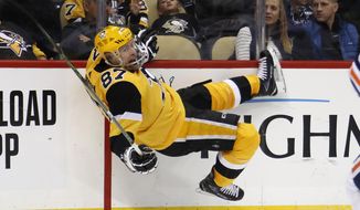 Pittsburgh Penguins&#39; Sidney Crosby is knocked off his skates by Edmonton Oilers&#39; Oscar Klefbom during the second period of an NHL hockey game in Pittsburgh, Saturday, Nov. 2, 2019. (AP Photo/Gene J. Puskar)