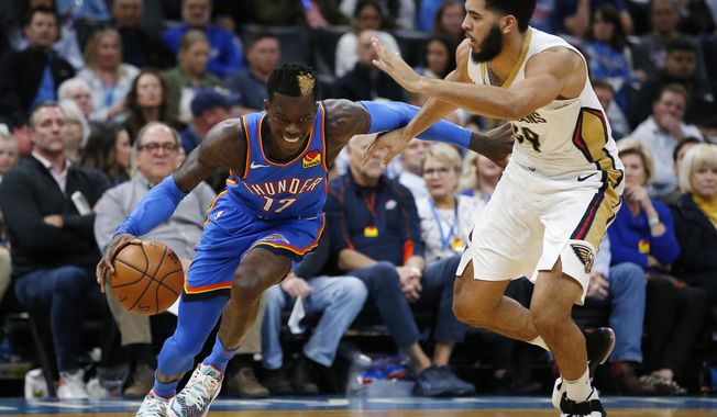 Oklahoma City&#x27;s Dennis Schroder (17) drives the ball past New Orleans&#x27; Kenrich Williams (34) during the second half of an NBA basketball game in Oklahoma City, Saturday, Nov. 2, 2019. (AP Photo/Garett Fisbeck)