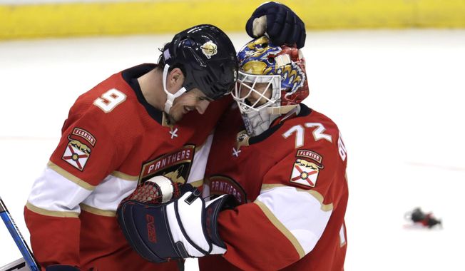 Florida Panthers center Brian Boyle (9) and goaltender Sergei Bobrovsky (72) embrace after the team&#x27;s NHL hockey game against the Detroit Red Wings, Saturday, Nov. 2, 2019, in Sunrise, Fla. The Panthers won 4-0. (AP Photo/Lynne Sladky)