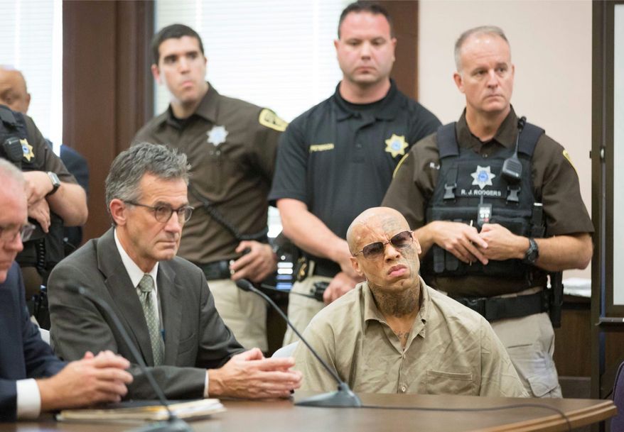 Nikko Jenkins (front right) who was convicted of killing four people in and around Omaha, Nebraska, in 2013, was sentenced to death by a three-judge panel in 2017. Jenkins wants the Supreme Court to review his sentence. (Associated Press)