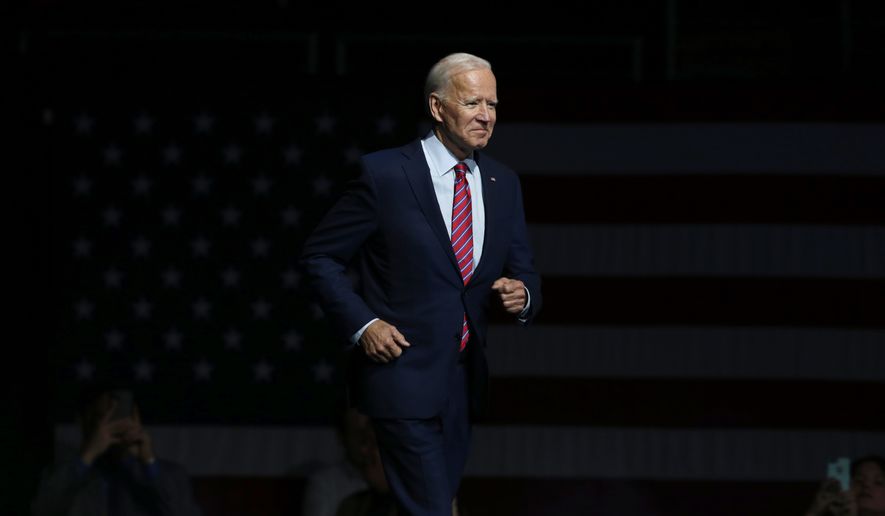 FILE - In this Friday, Nov. 1, 2019, file photo, Democratic presidential candidate former Vice President Joe Biden walks on stage to speak at the Iowa Democratic Party's Liberty and Justice Celebration, in Des Moines, Iowa. Biden is working on a national campaign of his own, but he made time for a trip to Virginia, Sunday, Nov. 3, to rally party activists two days before a pivotal state election. (AP Photo/Nati Harnik, File)